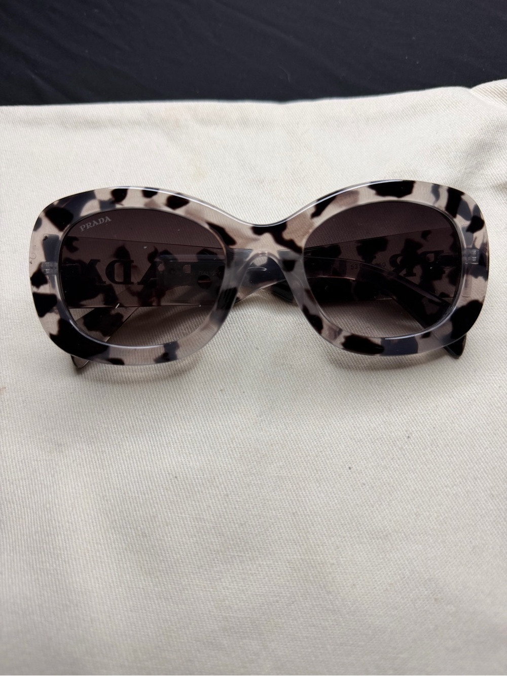 Prada Women’s Tortoiseshell Oval Sunglasses - Ivory & Black Frame, Gray Lenses